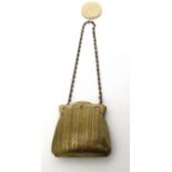 An early 20thC ladies brass coin purse with blue silk lining. Marked with Reg no.