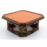 A Japanese lacquer squared pot stand with canted corners.