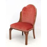 Art Deco : A Walnut shaped and Cloud back upholstered chair with ornate inlay to seat banding and