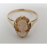 A 9ct gold ring set with cameo to top.