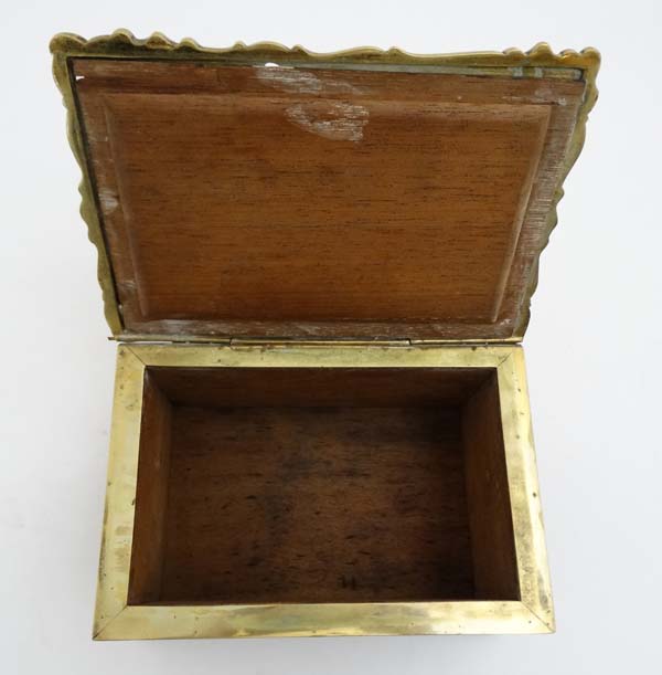 A late 19thC brass and cedar lined humidor with image to top of putti amongst Rococo brass ware 8" - Image 7 of 7
