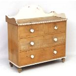 A Victorian stripped and painted pine wash stand / chest of drawers comprising 2 short over 2