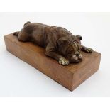 A 21stC cold painted bronze model of a boxer / English bull dog recumbent upon a rouge marble base.