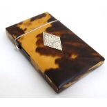 A 19thC blonde tortoiseshell card case with white metal diamond inlay.