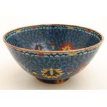 An Oriental Cloisonne bowl with character marks under.