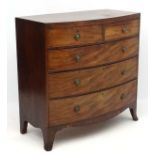 A Regency bow front mahogany chest of drawers comprising 2 short over three graduated long drawers