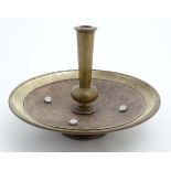 A Persian copper and brass stand with chalcendony like cabochon decoration.