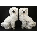 A Large Lair of Victorian Staffordshire seated spaniel mantel dogs,