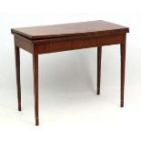 An early 19thC mahogany fold over tea table with stringing and single hinged leg 35 3/4" wide