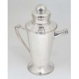 A 21stC Art Deco style cocktail shaker with menu / recipe dial and pouring spout 11 1/2" high