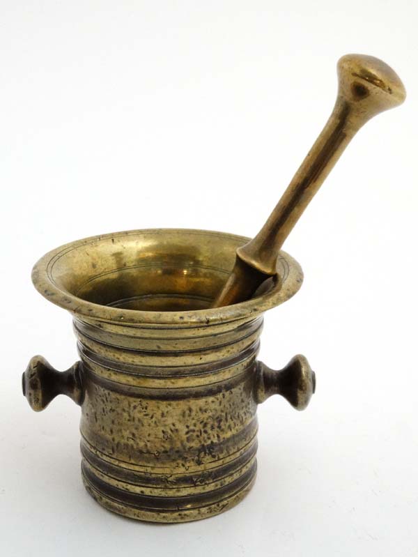 A 19thC brass Apothecary's pestle and mortar. The Mortar 4'' high. - Image 3 of 4