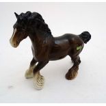 A Beswick model formed as a Cantering Shire horse , number 975 in bay gloss finish, 1943-1989,