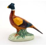 A Beswick model formed as a standing pheasant , number 767B , stamped to base. 3'' high.