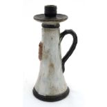 A Continental studio pottery Tavern tall handled candle stick,