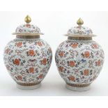 A large pair of Chinese lidded bulbous vases,