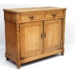 A c.1900 oak buffet / short sideboard with two drawers over two cupboards.