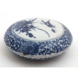 A Chinese blue and white inkbox the central cartouche decorated with butterflies and flora,