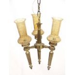 Light : a circa 1978 Neo - Classical electroliere in the form of three brass torches united ,