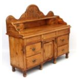 A Victorian carved pine sideboard 53" high x 59" wide x 22" deep CONDITION: Please