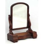 A Victorian mahogany large toilet mirror with central compartment flanked by drawers.