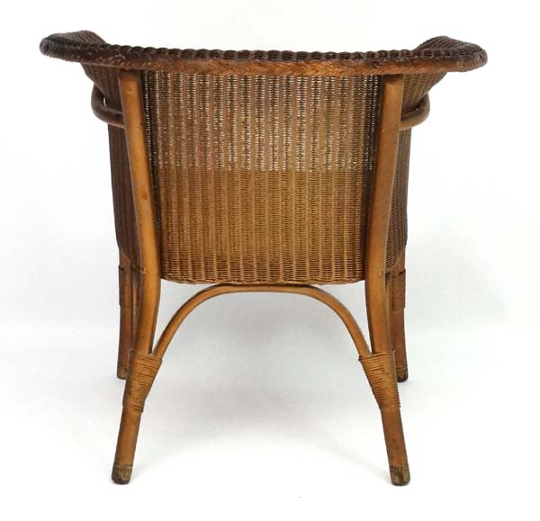 W Lusty & Sons Ltd - A Lloyd Loom armchair. Labelled. - Image 4 of 7