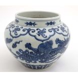 A Chinese Blue and white pomegranate jar decorated with Dogs of Fo and pearls of wisdom amongst