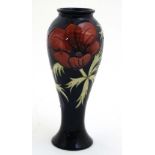 A c1994 Moorcroft vase in tube lined Anemone pattern on cobalt blue ground,