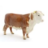 A Beswick model formed as a Hereford Bull , number 949 in gloss finish, bears factory stamp under.