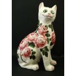 Wemyss : A Brian Adams Exon Pottery Wemyss ware figure of a seated cat,