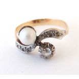 A yellow metal ring set with pearl and white stones CONDITION: Please Note - we do