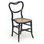 A Victorian ribbon back papier-mache cane seated ebonised chair with gilt detail 30 1/2" high