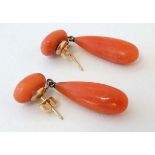 A pair of yellow metal and coral drop earrings. Approx.