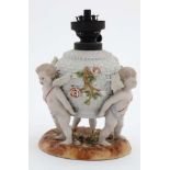 A c1900 Von Schierholz figural oil lamp , the body of basket weave decoration ,