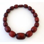 A Vintage bead necklace of graduated cherry coloured beads.