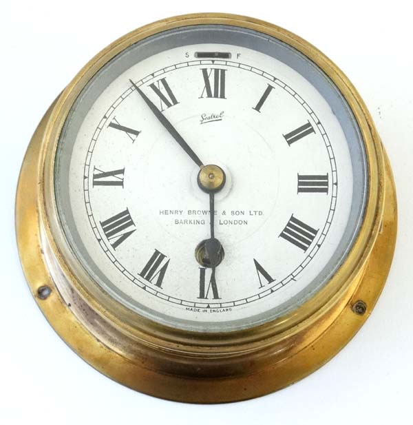 Ship's Clock : an brass cased 30 hr Timepiece , marked ' Sestrel ' with silvered dial ,