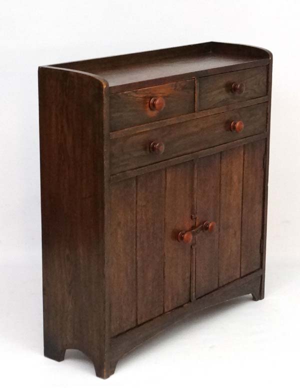 Heal & Son: An oak side cabinet of 2 short.