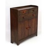 Heal & Son: An oak side cabinet of 2 short.