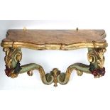 An early 20thC Venetian gilded and carved wooden console table of cupids bow form with polychrome