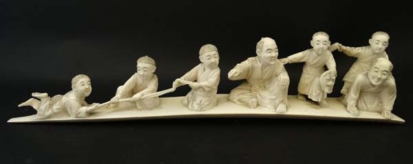 A Meiji period okimono depicting 2 seated figures and 4 boys, one on a hobby horse etc. - Image 3 of 5