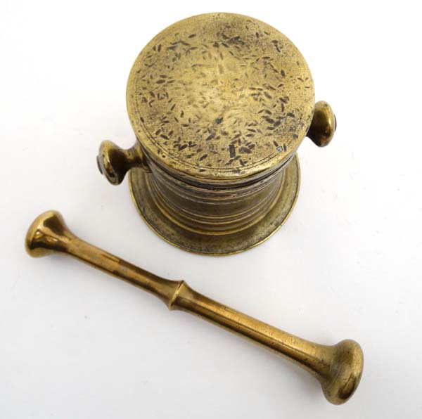 A 19thC brass Apothecary's pestle and mortar. The Mortar 4'' high. - Image 2 of 4