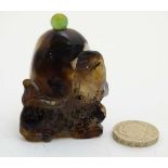 A Chinese carved agate snuff bottle with image of kaolin to base 2 3/8" high CONDITION: