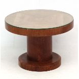 Art Deco : a Oak circular coffee table of pedestal form with plate glass top over a quarter