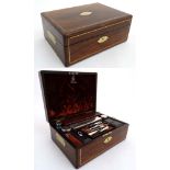 A brass inlaid rosewood work box opening to reveal leather lined interior,