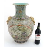 A large Chinese famille rose twin handled baluster vase with flared rim ,