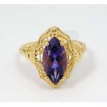 A Silver gilt ring set with central amethyst.