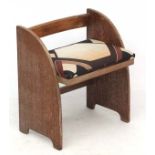 Art Deco : a limed oak Heals style low chair with patterned upholstered seat,