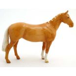 A Beswick model formed as a Palomino Huntsmans horse , number 1484 in gloss finish,