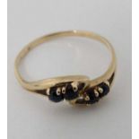 A 9ct gold ring set with 4 sapphires CONDITION: Please Note - we do not make