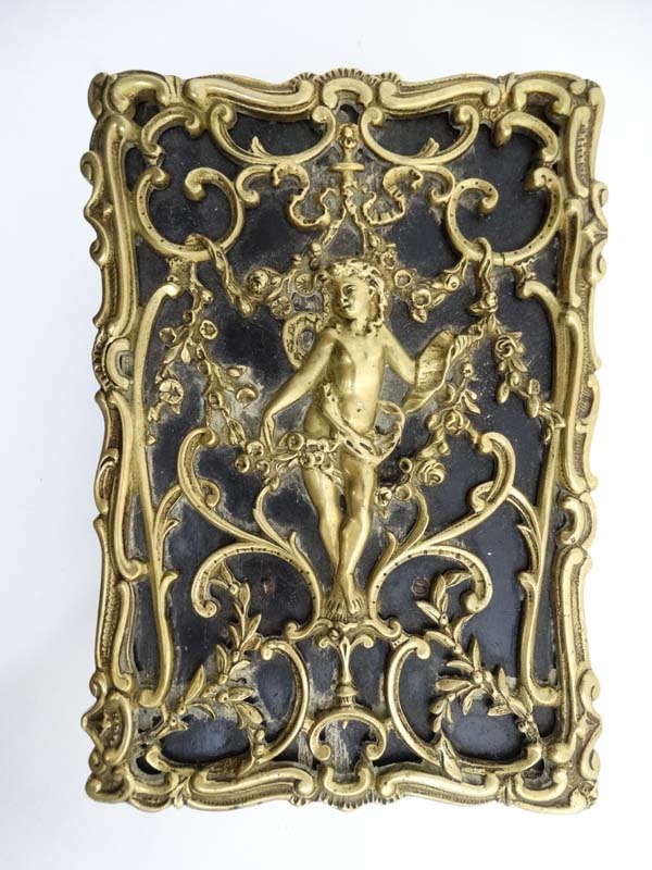 A late 19thC brass and cedar lined humidor with image to top of putti amongst Rococo brass ware 8" - Image 2 of 7