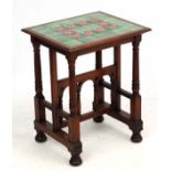 A late 19thc Aesthetic Movement / Arts and Crafts occasional table with tile top having tube lined